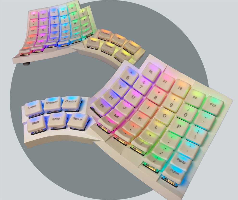 Rainbow LEDs lit up on Glove80 gamer edition ergonomic keyboard