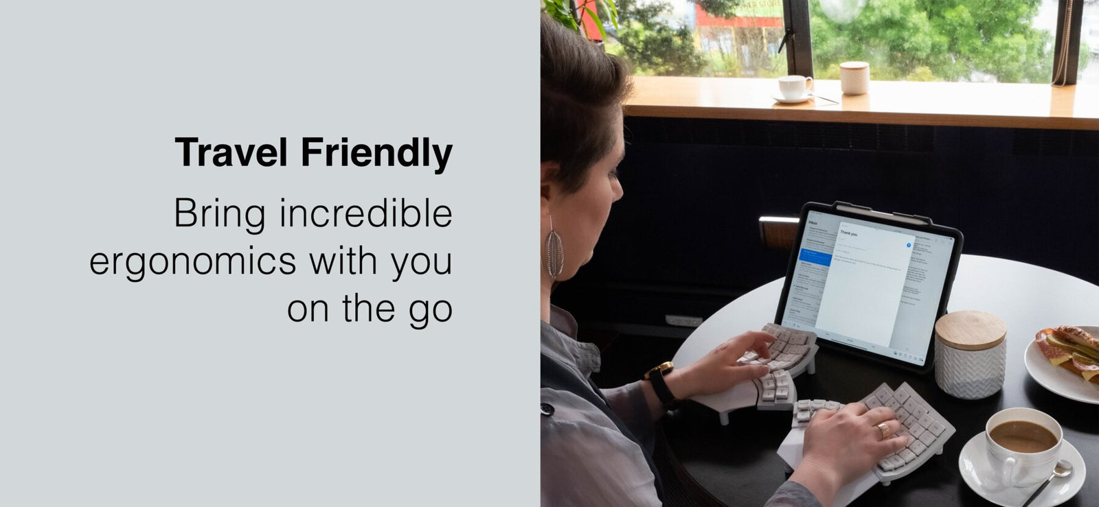 Office worker uses Glove80 keyboard wirelessly on tablet